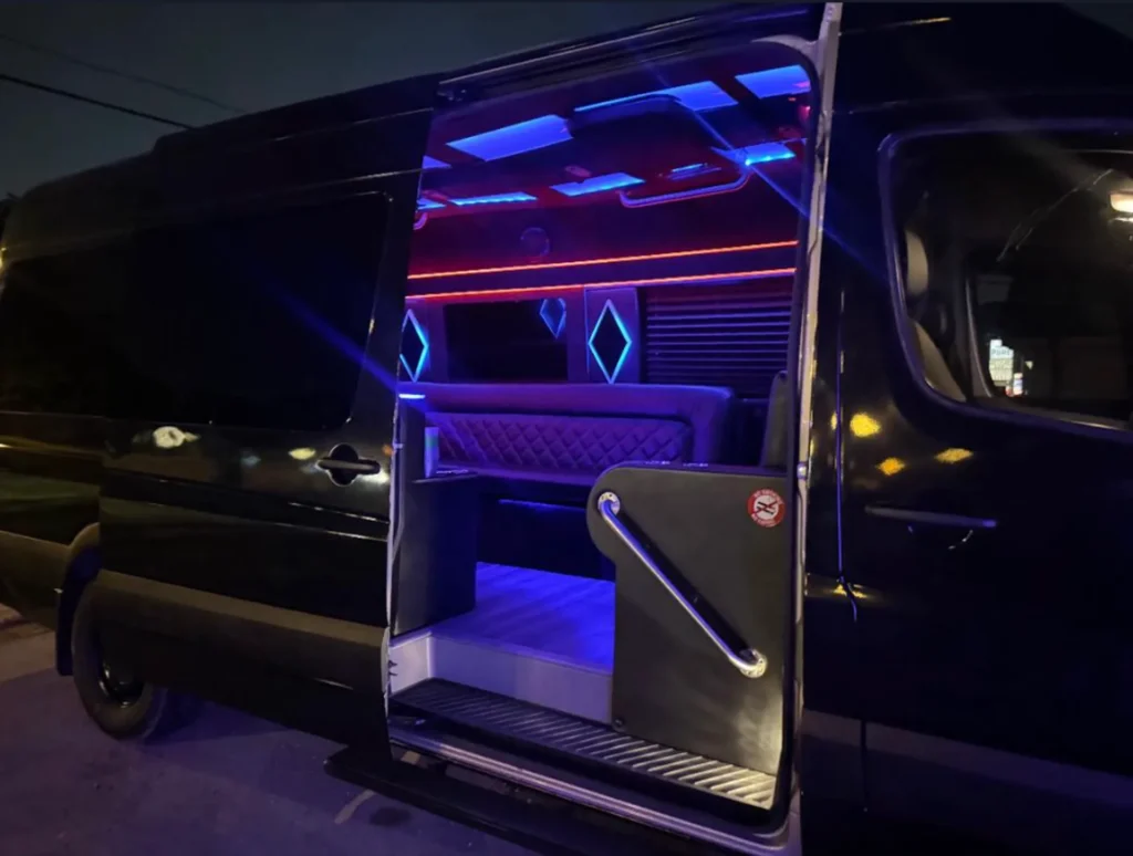 Luxury sprinter van interior with mood lighting and leather bench seating